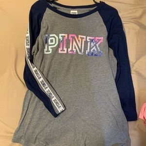 PINK 3/4 sleeve raglan style shirt.